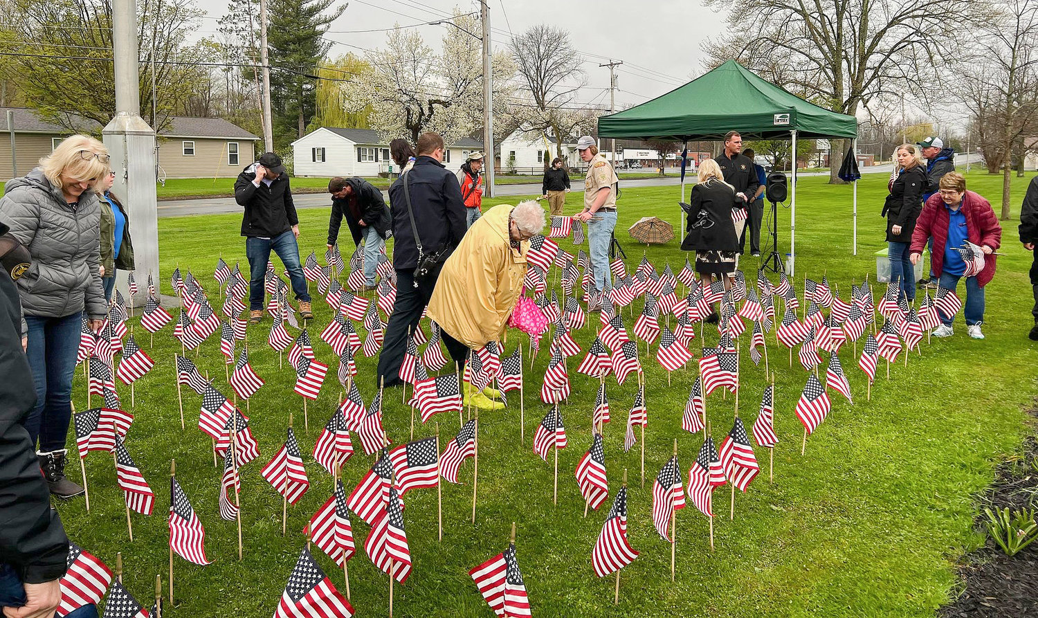 FLAG GARDEN IN ONEIDA — Oneida residents and officials honor those lost with the planting of the Memorial Flag Garden. Hosted by the Oneida Memorial Association, the fourth annual Flag Garden ceremony displays the 108 names of Oneida citizens who served in the military — from the Civil War to the War on Terror.