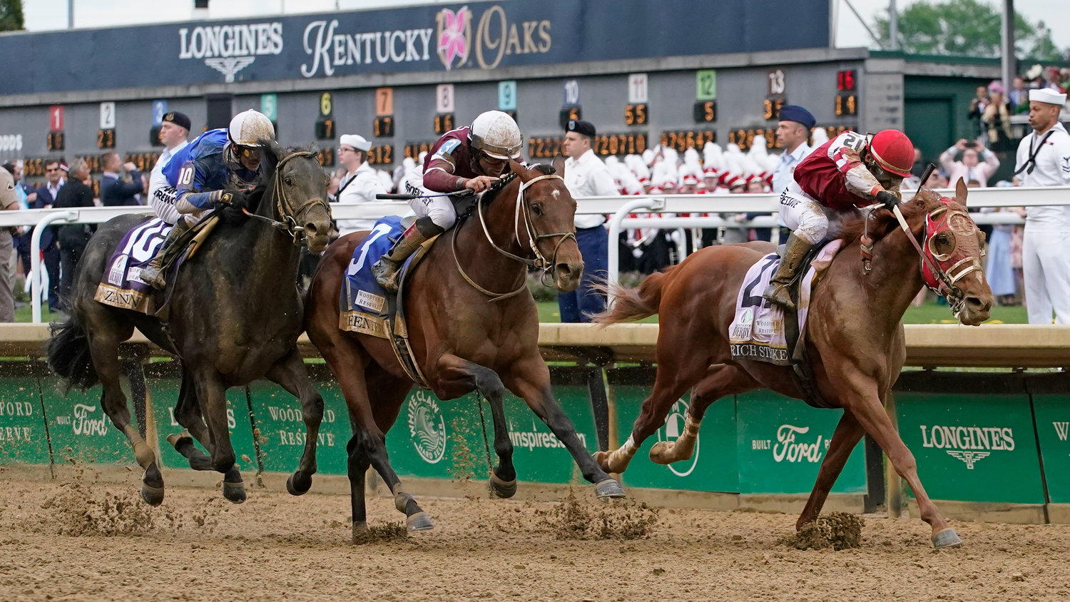 Rich Strike, right, with Sonny Leon aboard, leads the field to win the 148th running of the Kentucky Derby on Saturday in Louisville, Ky.