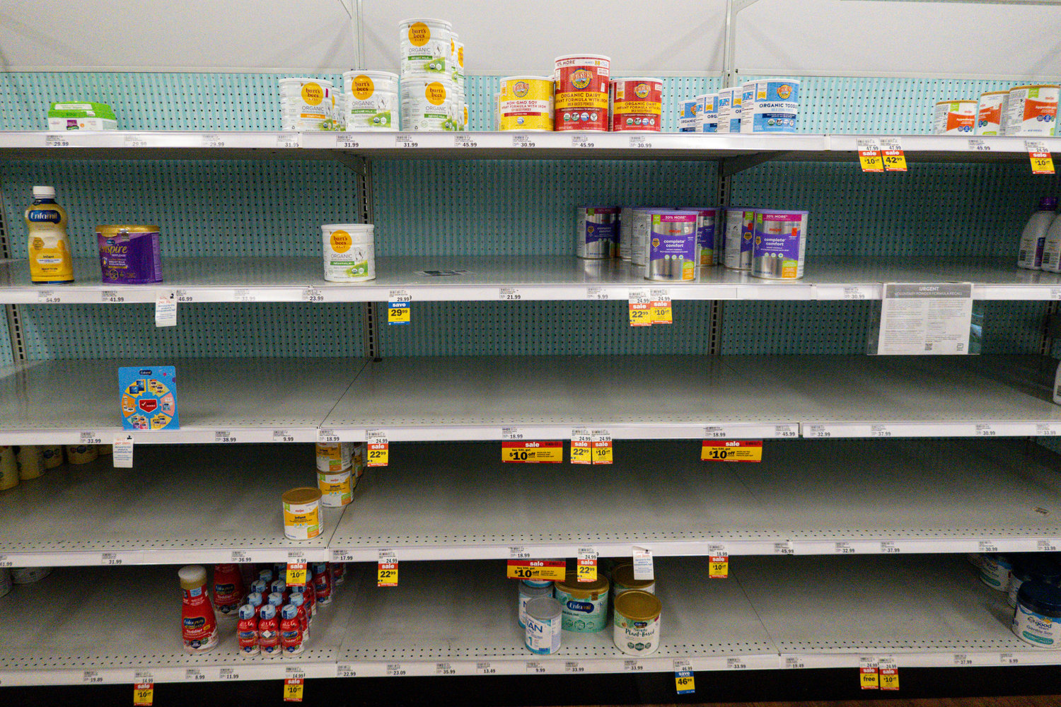 Baby formula is displayed on the shelves of a grocery store in Carmel, Ind., Tuesday, May 10, 2022. Parents across the U.S. are scrambling to find baby formula because supply disruptions and a massive safety recall have swept many leading brands off store shelves. (AP Photo/Michael Conroy)