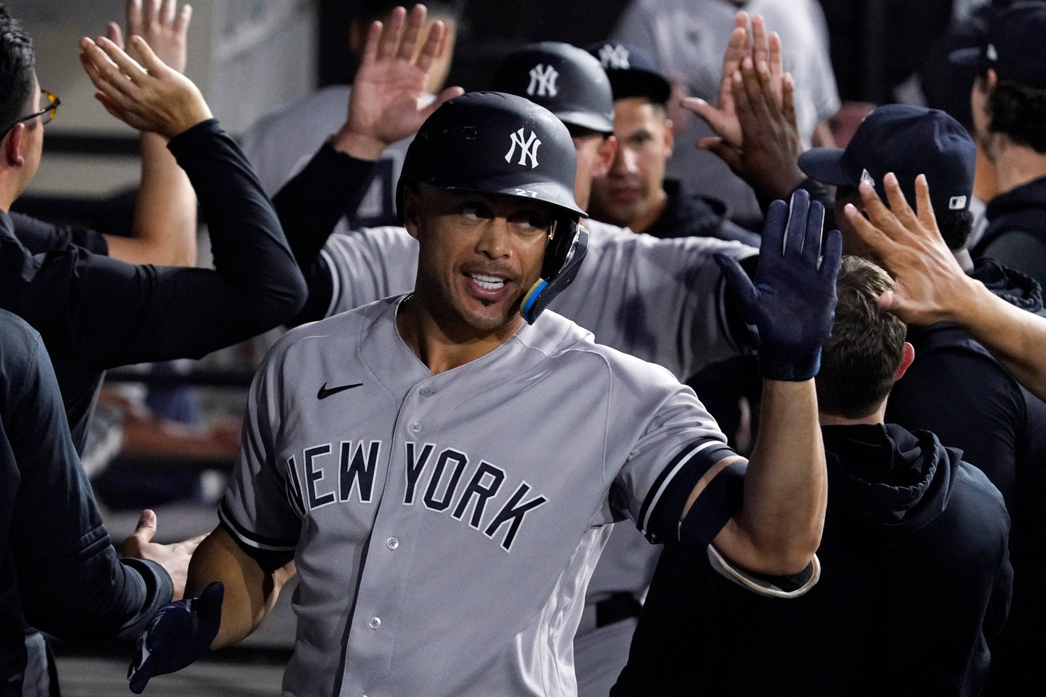 New York Yankees slugger Giancarlo Stanton is congratulated after his two-run home run against the Chicago White Sox during the third inning in Chicago on Thursday night.