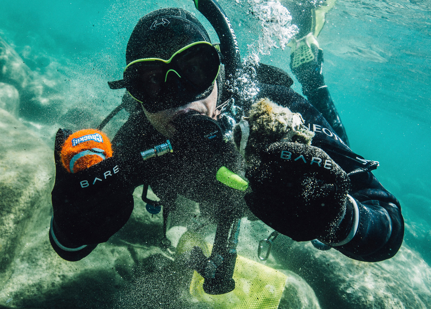 In this photo provided by Clean Up The Lake, CUTL diver Colin West shows debris found in the lake from an initial dive in 2020, at Lake Tahoe, Nev.