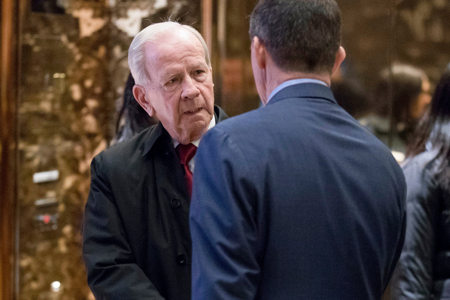 FILE - Robert C. McFarlane, left, is escorted by Michael Flynn, President-elect Donald Trump's nominee for national security adviser, right, as he departs Trump Tower, Dec. 5, 2016, in New York. McFarlane, a top aide to President Ronald Reagan who pleaded guilty to charges for his role in an illegal arms-for-hostages deal known as the Iran-Contra affair, died Thursday, May 12, 2022. He was 84. (AP Photo/Andrew Harnik)