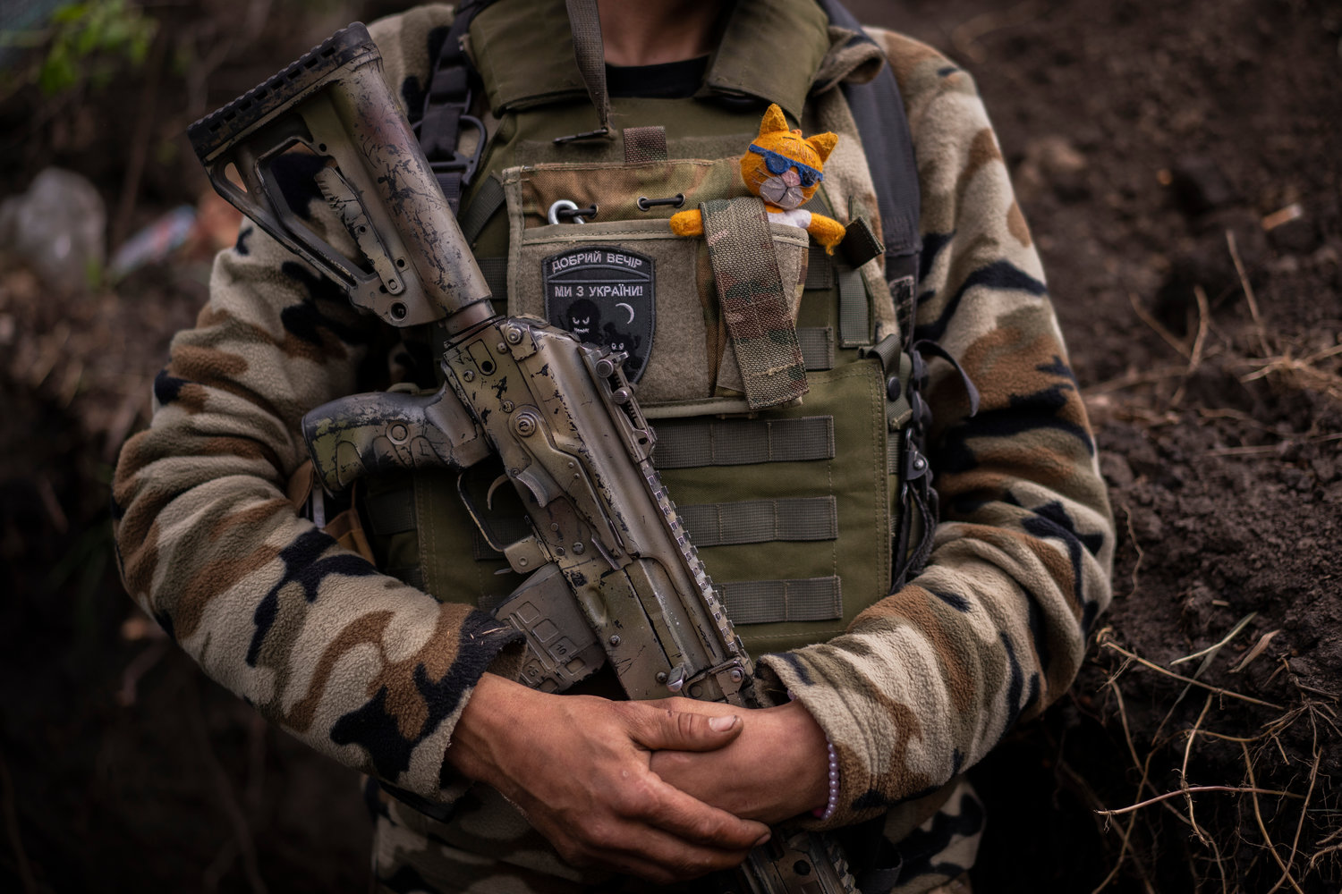 Zhenia, a member of the Ukrainian territorial defence force, guards a position near Kutuzivka, east Ukraine, Friday, May 13, 2022. (AP Photo/Bernat Armangue)