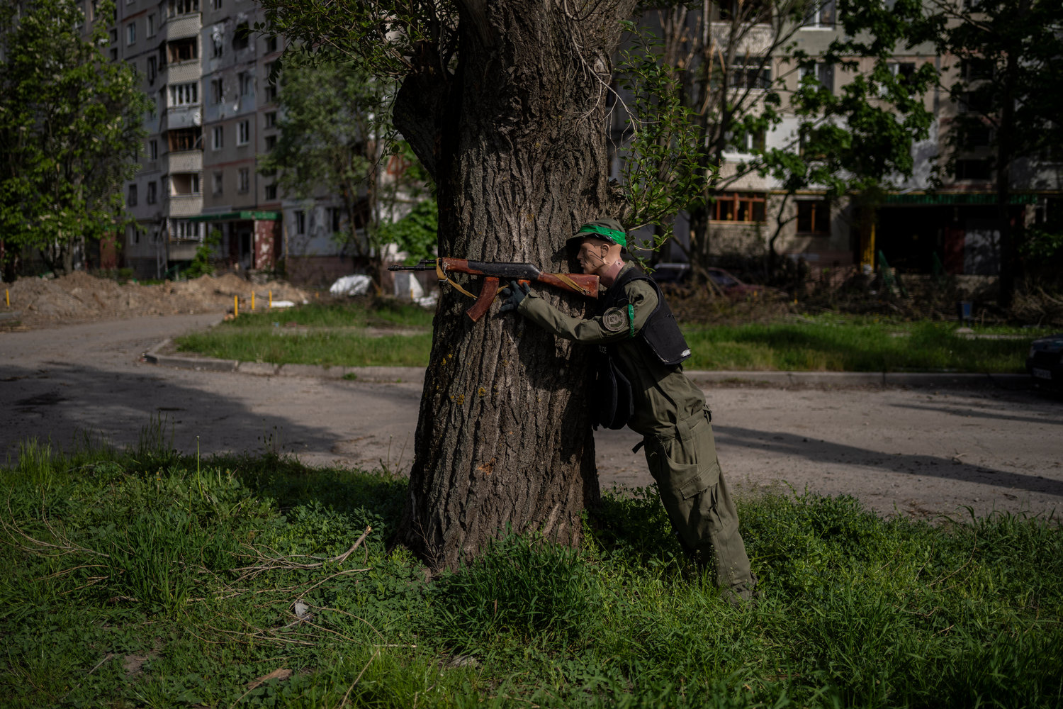 A mannequin dressed as a soldier is placed near a road in north Kharkiv, Ukraine, Friday, May 13, 2022. (AP Photo/Bernat Armangue)