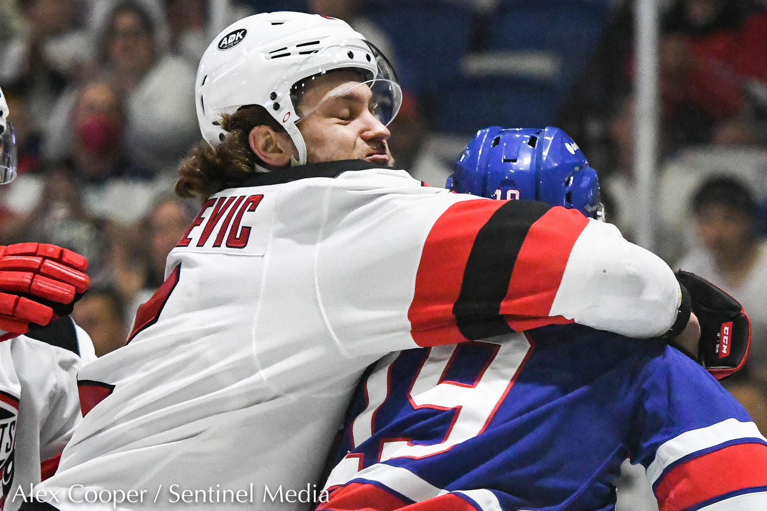 Comets player Michael Vukojevic fights Rochester's Peyton Krebs during the playoff game on Saturday.