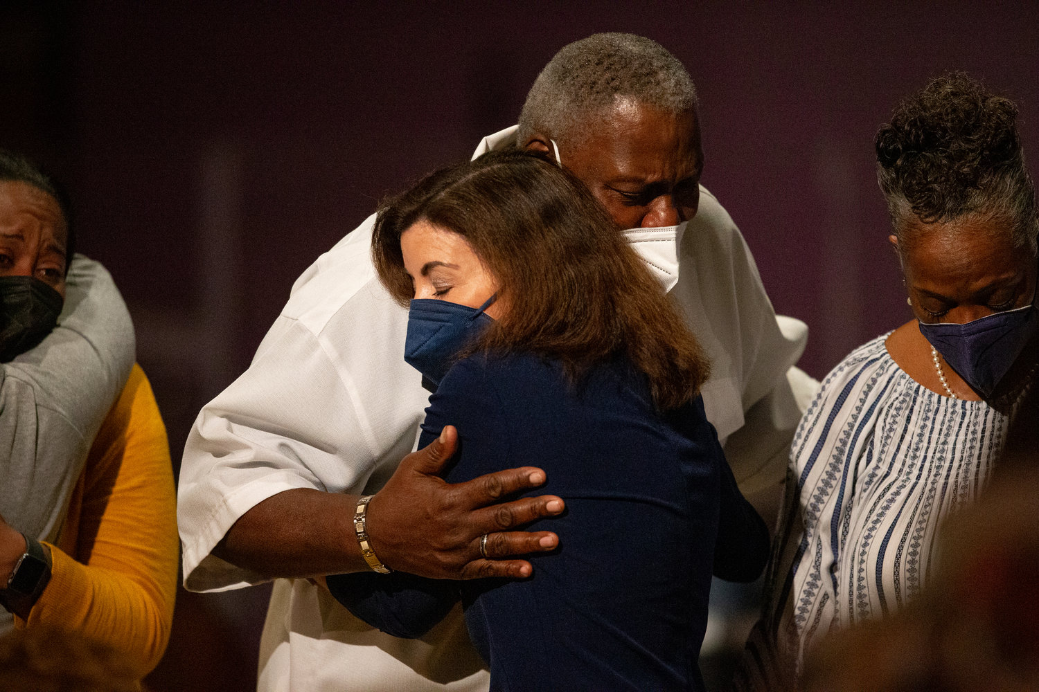 New York Gov. Kathy Hochul hugs Charles Everhart Sr. as service ends at True Bethel Baptist Church on Sunday, May 15, 2022, in Buffalo, N.Y.. Everhart's grandson, Zaire Goodman, was shot in the neck and survived during a shooting at a Buffalo supermarket on May 14. Goodman was released from the hospital last night. "I'm just grateful that God saved his life," said Everhart. (AP Photo/Joshua Bessex)