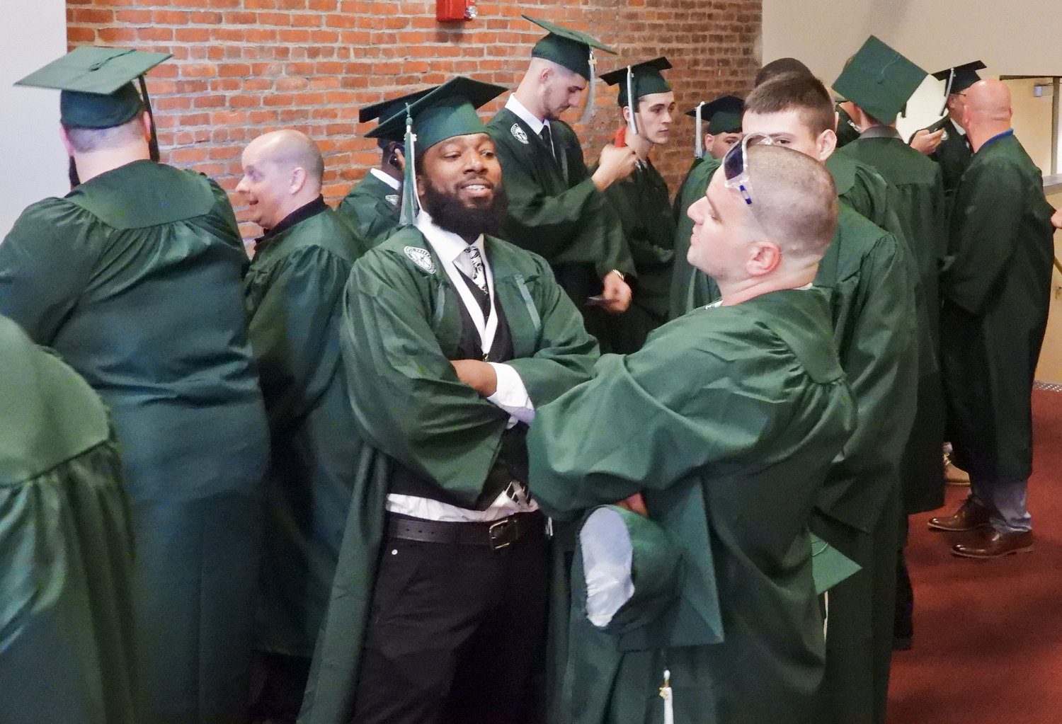 Mohawk Valley Community College graduates talk and celebrate their eminent graduation at the Stanley Theater on Friday, May 13.