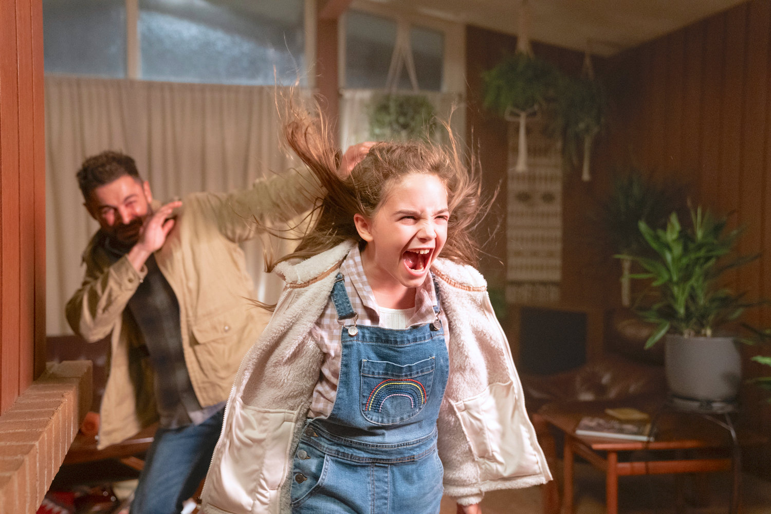 Zac Efron as Andy, left, and Ryan Kiera Armstrong as Charlie in a scene from “Firestarter.”