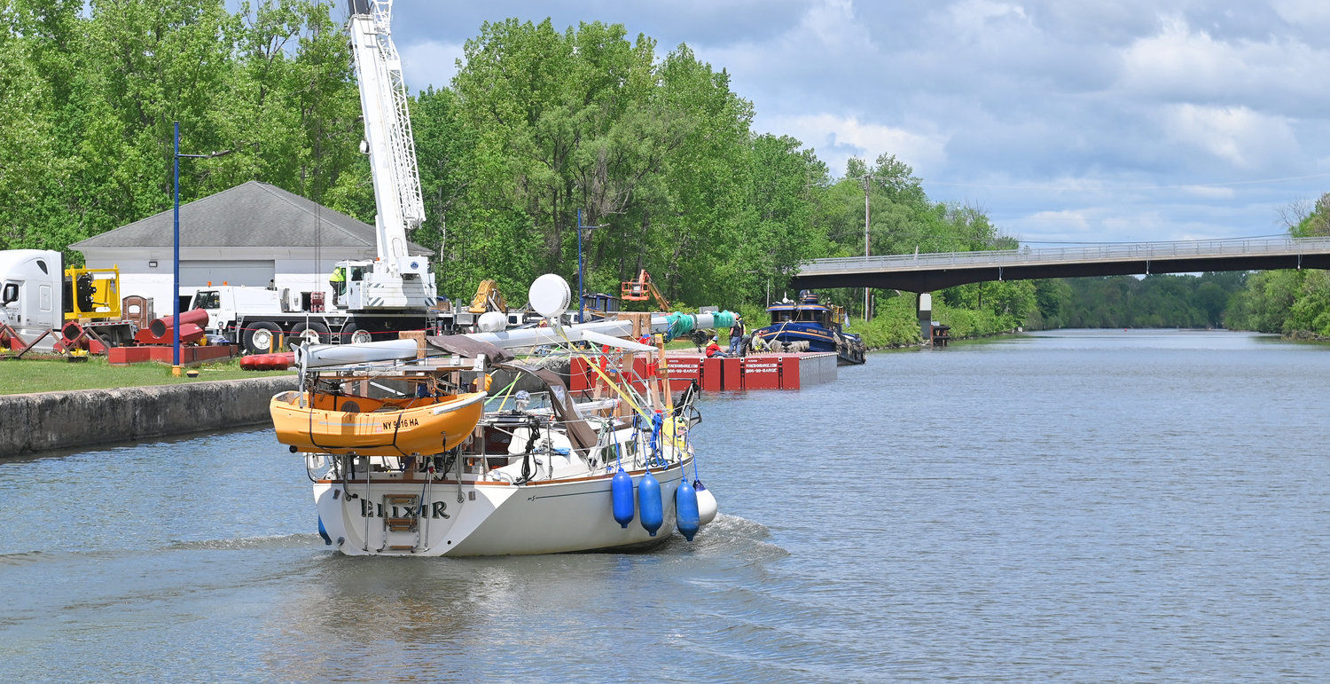 A boat heads west on the Erie Canal after passing through Lock 20 in Marcy on Monday.  State officials opened the canal navigation season over the weekend.