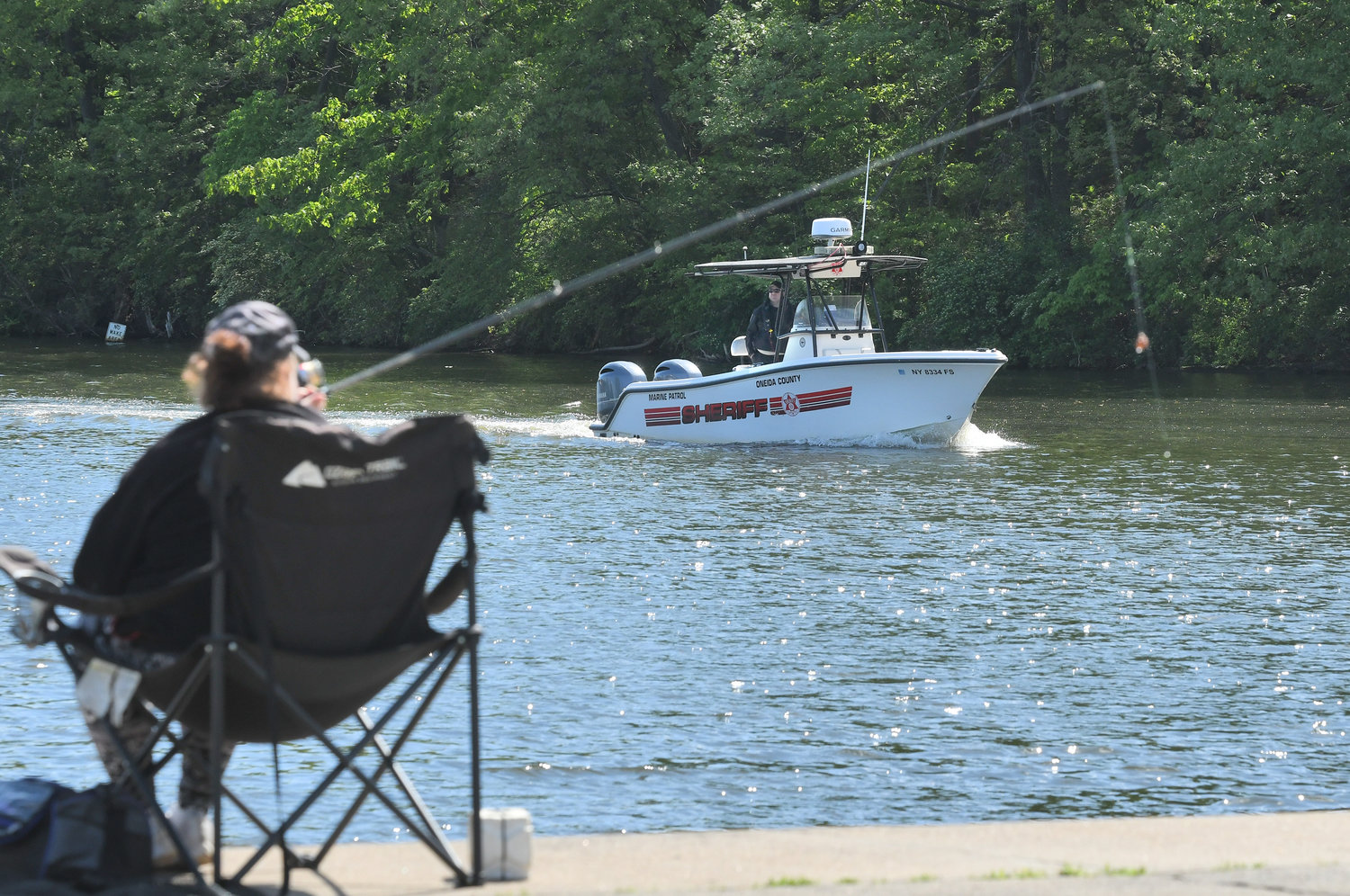Sheriff’s Sgt. Scott Kahl, supervisor of the Marine Patrol, takes one of the unit’s boats on a trip through the canal at Sylvan Beach Tuesday morning. The warm weather has already begun to bring out fishermen and boaters.