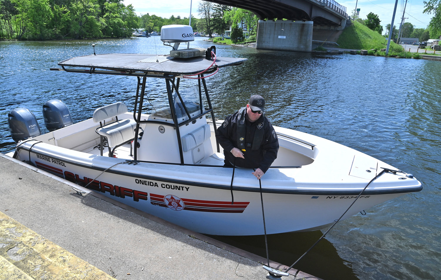 Sheriff's Sgt. Scott Kahl ties up one of the Marine Patrol's boats at the canal in Sylvan Beach Tuesday morning. The Marine Patrol has five boats in total, and they patrol all lakes in Oneida County every summer.