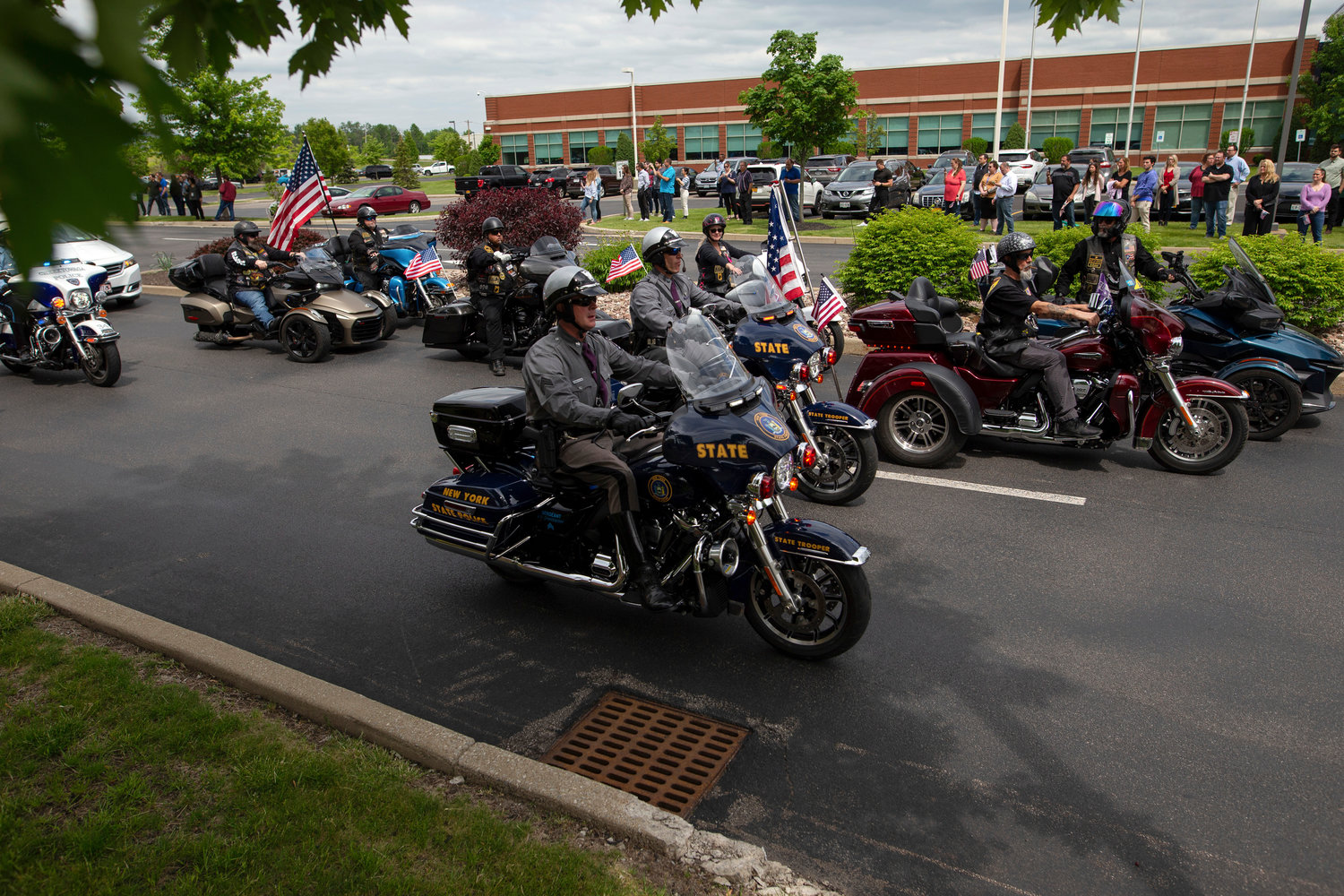 New York State Troopers lead a procession after the funeral service for Aaron Salter Jr. at The Chapel at Crosspoint on Wednesday, May 25, 2022, in Getzville, N.Y. Salter Jr. was killed in the Buffalo supermarket shooting on May 14. (AP Photo/Joshua Bessex)
