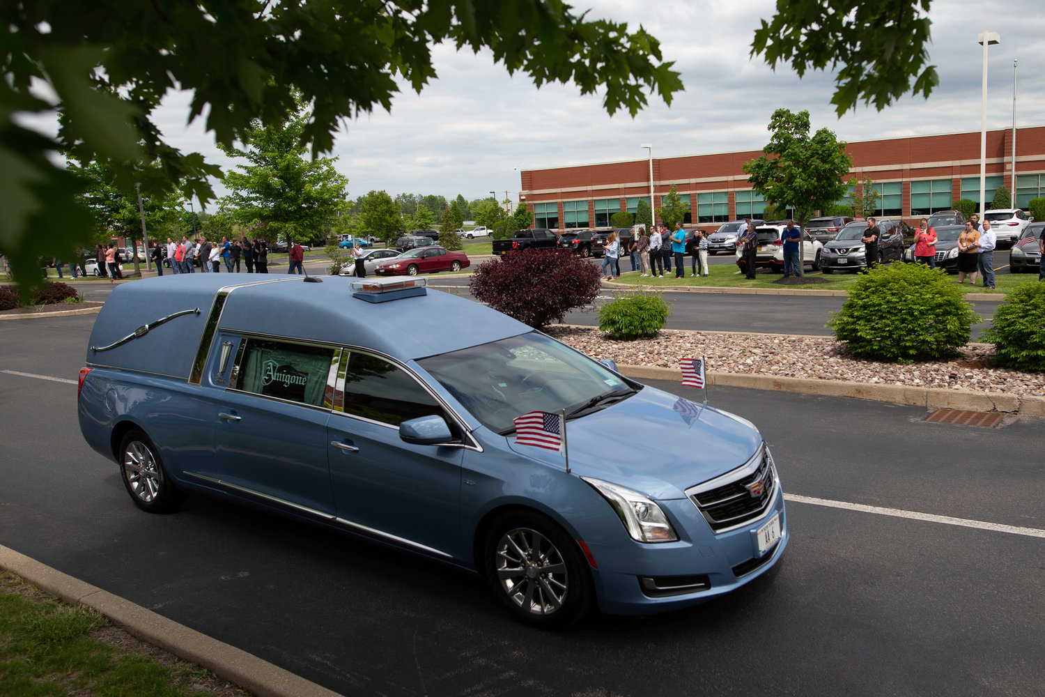 A hearse containing the casket for Aaron Salter Jr. leaves after a funeral service at The Chapel at Crosspoint on Wednesday, May 25, 2022, in Getzville, N.Y. Salter Jr. was killed in the Buffalo supermarket shooting on May 14. (AP Photo/Joshua Bessex)