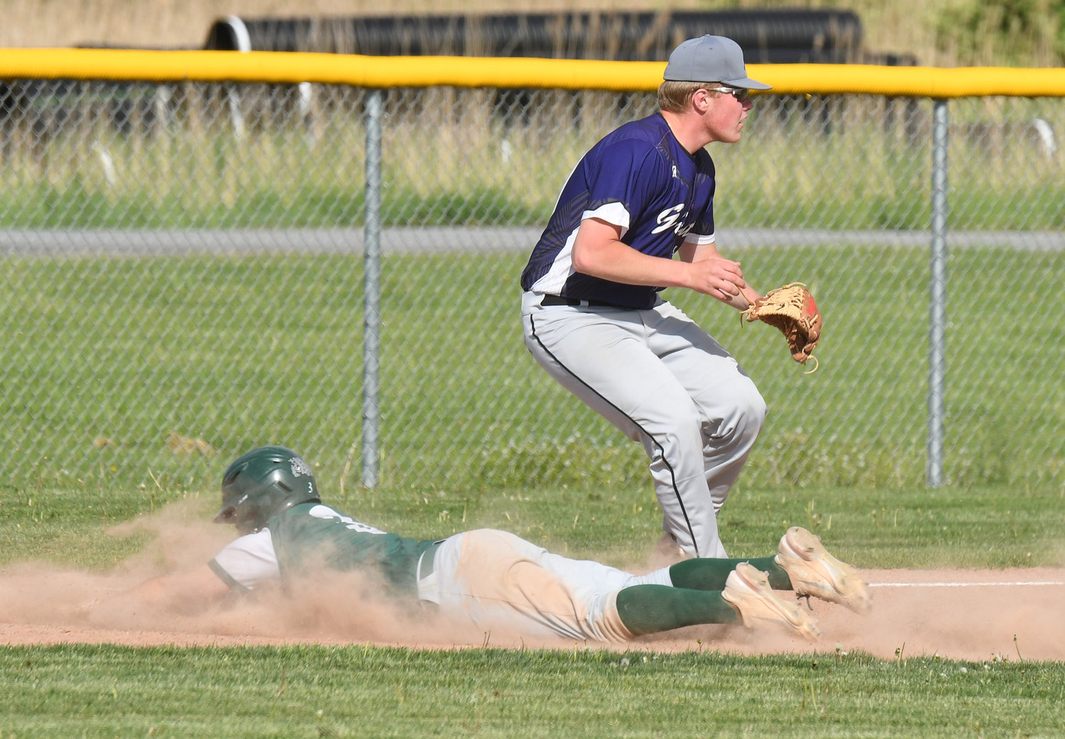 Westmoreland baserunner Joshua Suber slides head first into third base against Alexandria Tuesday. The Bulldogs won 18-1 to advance to the Section III Class C quarterfinals. Suber had a single, sacrifice fly, run scored and two RBIs.