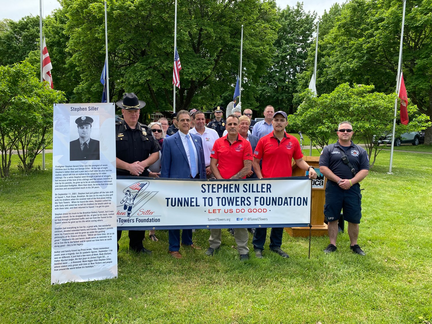 Local officials were on hand to mark the return of the Tunnel to Towers 5K Run and Walk.  From left: Oneida County Sheriff Robert Maciol, Utica Mayor Robert Palmieri, Tunnel to Towers Race Directors Phil Trzcinski and Alex Gonzalez, and other city and area representatives, event sponsors and various first responders.
