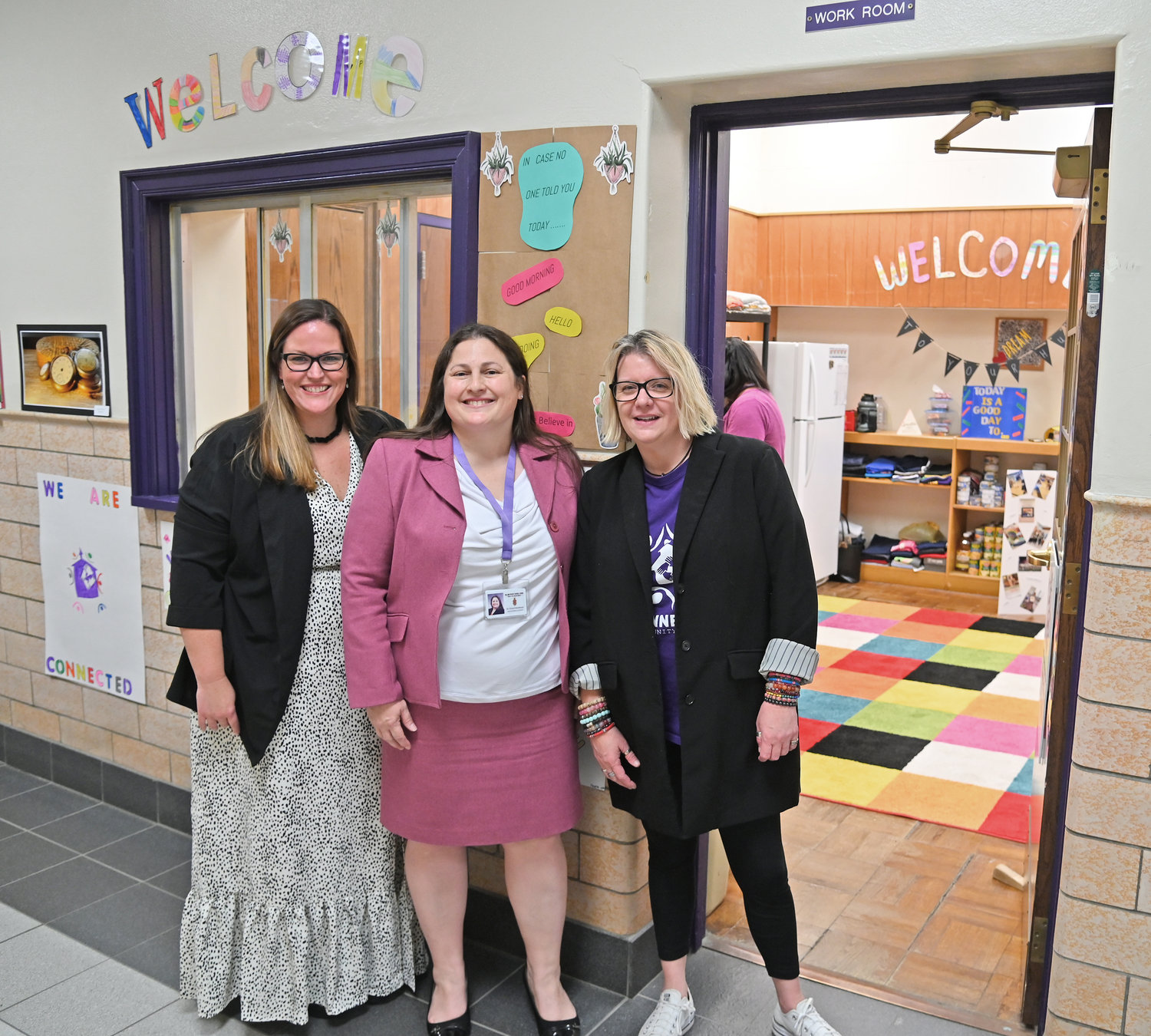 Officials unveil the new Connected Community Schools room at the Holland Patent Middle School, following a ceremonial ribbon-cutting on Wednesday. From left: Danielle Martin, co-leader of the Connected Community School program; Holland Patent Superintendent Dr. Cheryl Venettozzi; and Melissa Roys, co-leader of the CCS program.