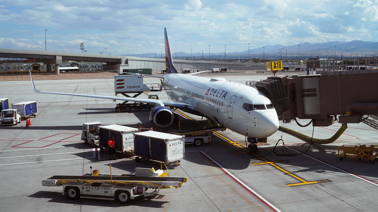 A Delta plane is shown at a gate at Salt Lake City International Airport on July 1, 2021, in Salt Lake City. Airline travelers are not only facing sticker shock this Memorial Day weekend, the kick off to the summer travel season, but they're also battling a pileup of flight cancellations. Delta Air Lines suffered the most, with more than 230 flights, or 8% of its operations,  eliminated on Saturday, May 28, 2022.