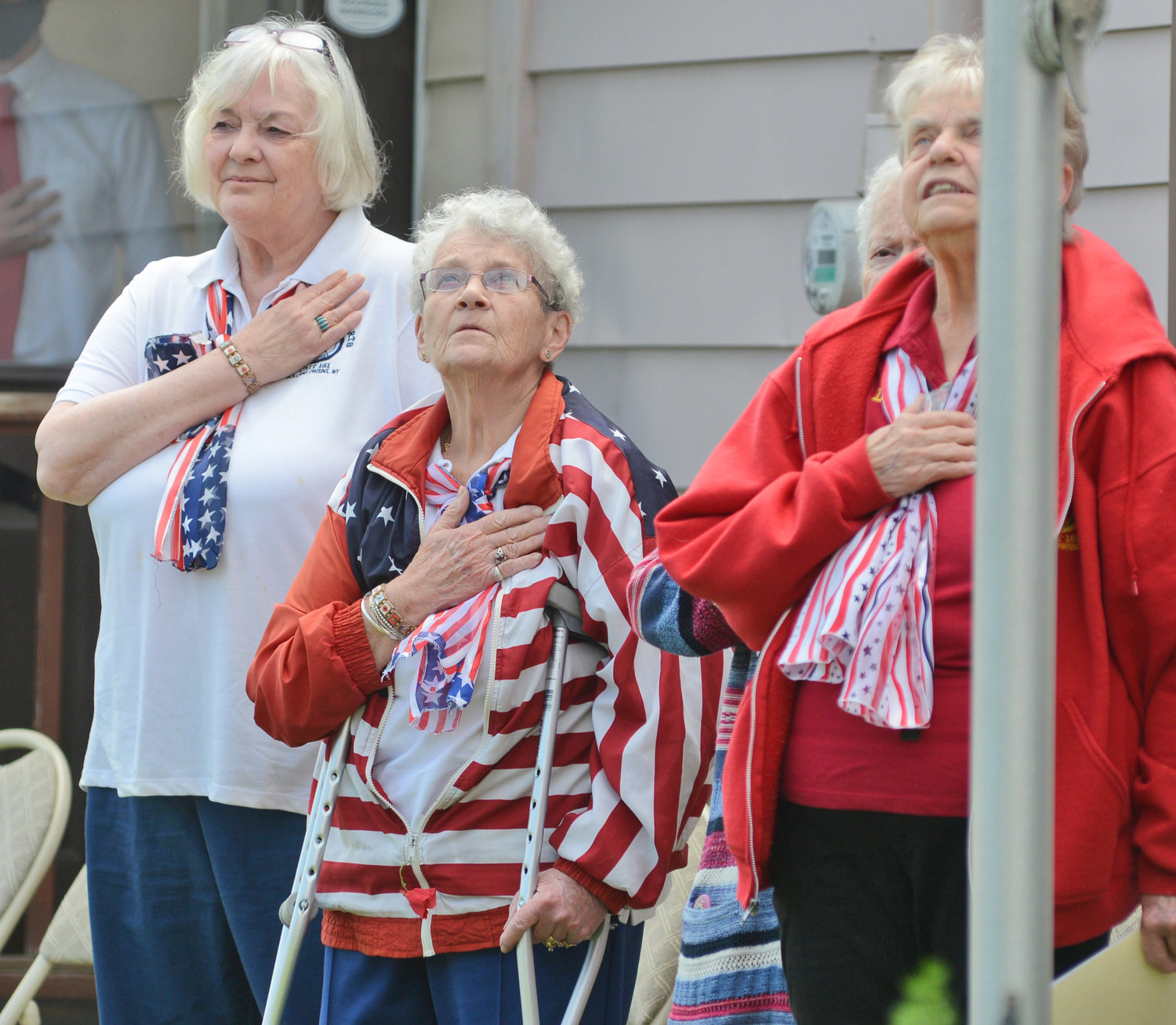 Nancy Tuttle, Cathy Gates and Debbie Roberts during the National Anthem at the Leon Roberts Legion Post in 2021.