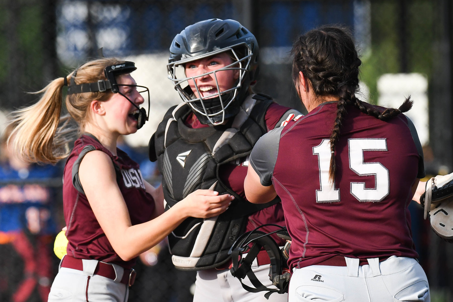 Oriskany catcher Kaelyn Buehler yells in excitement with teammates after winning the Section III Class D final 5-4 against Poland on Tuesday at Carrier Park in Syracuse.