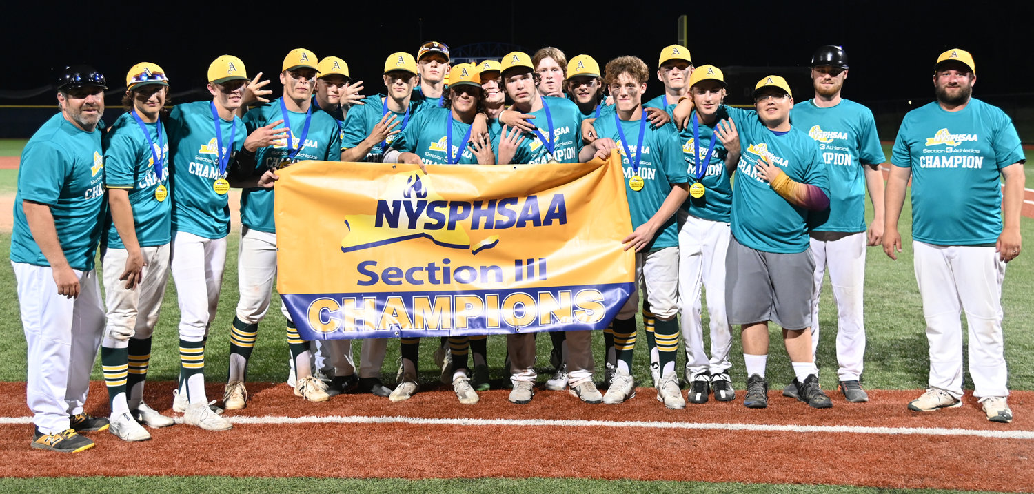 Adirondack Wildcats show off the Section III Class C baseball championship banner they earned by defeating Westmoreland Tuesday night 6-2 at Onondaga Community College.