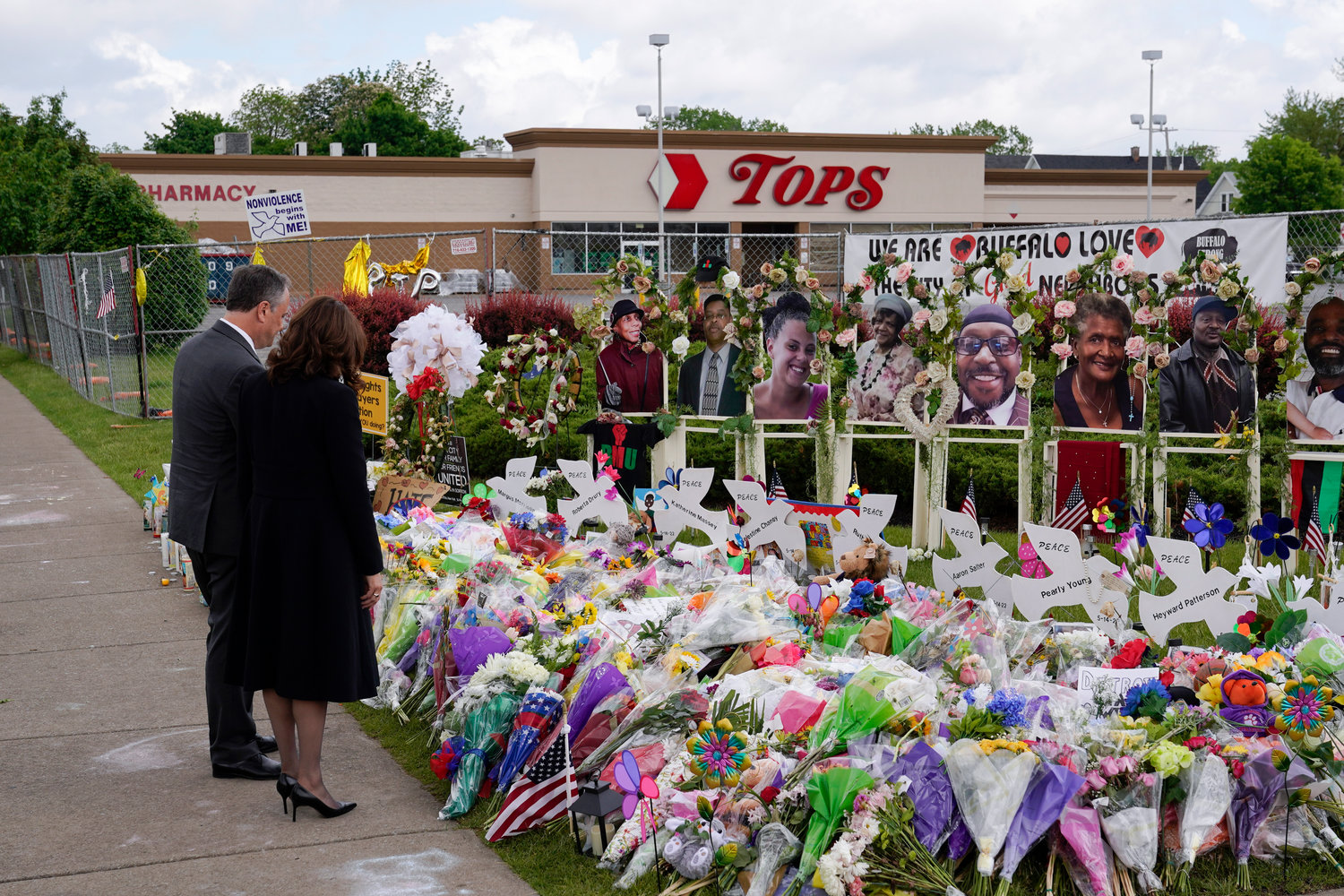 Vice President Kamala Harris and her husband Doug Emhoff visit a memorial near the site of the Buffalo supermarket shooting after attending a memorial service for Ruth Whitfield, one of the victims of the shooting, Saturday, May 28, 2022, in Buffalo, N.Y. (AP Photo/Patrick Semansky)