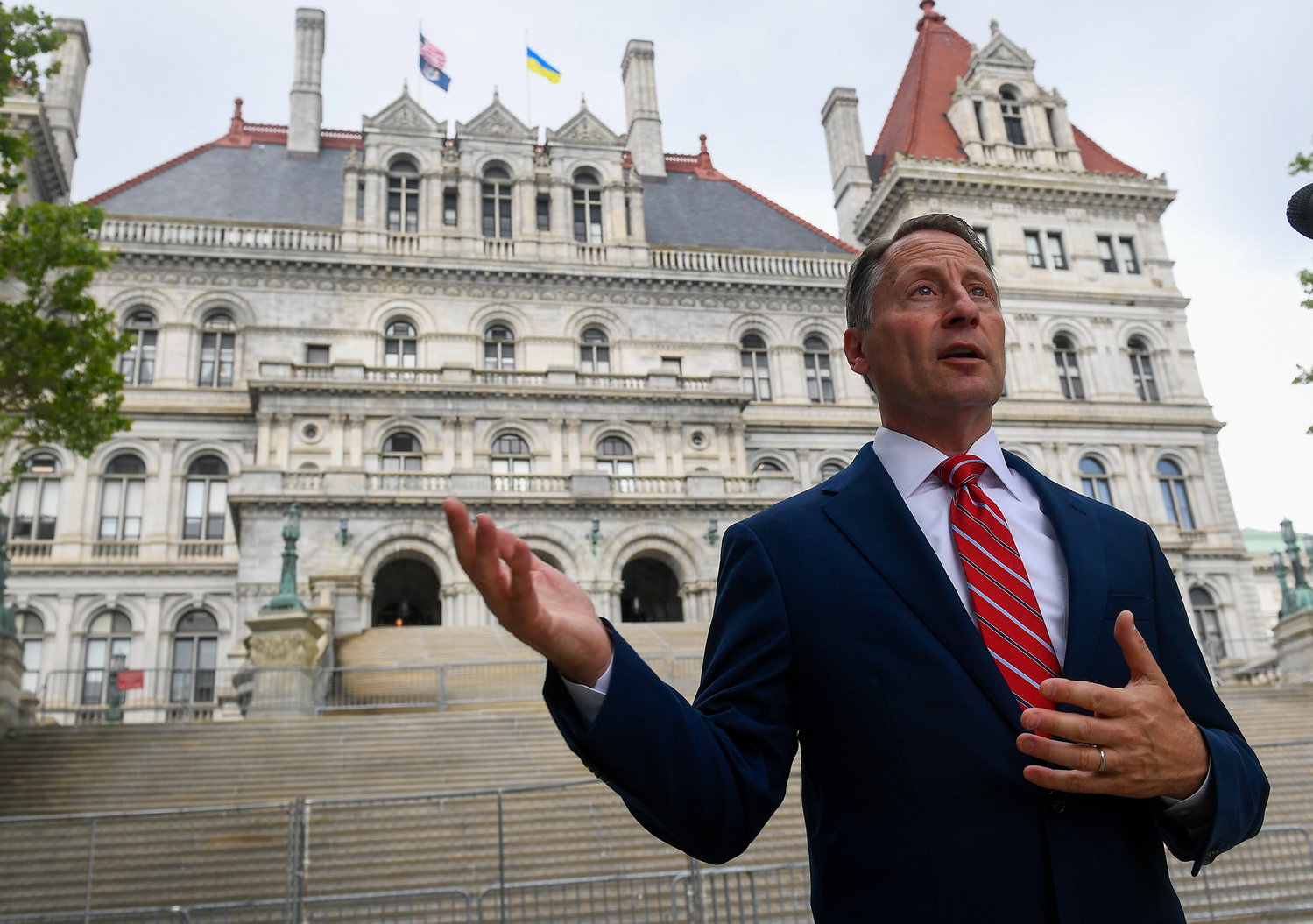 Republican candidate for New York Governor Rob Astorino speaks to a reporter about gun laws and election issues outside the state Capitol on the last scheduled day of the 2022 legislative session, Thursday, June 2, 2022, in Albany, N.Y. (AP Photo/Hans Pennink)