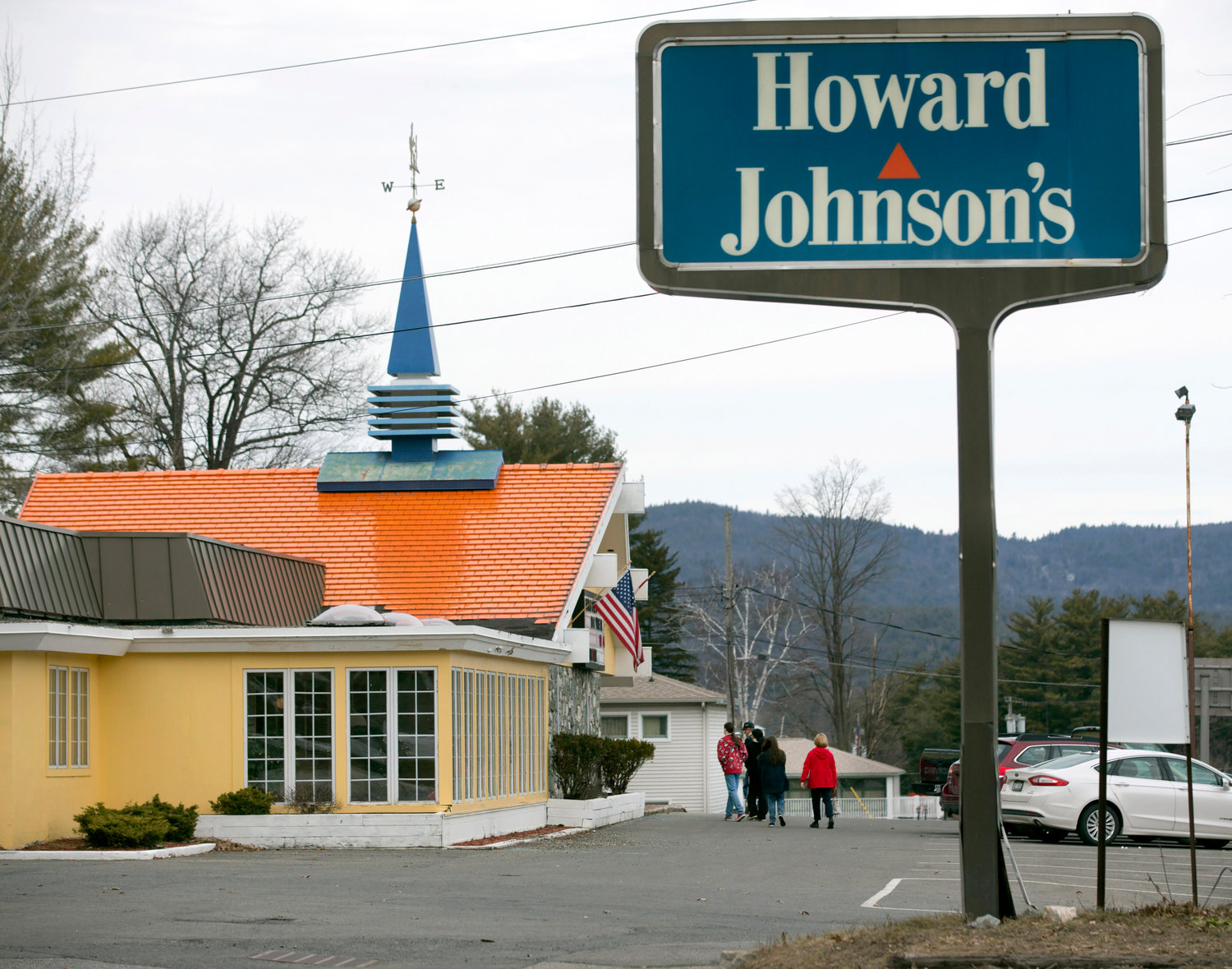 Customers walk into Howard Johnson's Restaurant in Lake George on April 8, 2015. The Howard Johnson's restaurant in this upstate New York resort village — the last of the once-pervasive eateries serving food under orange roofs with blue spires — is closed.