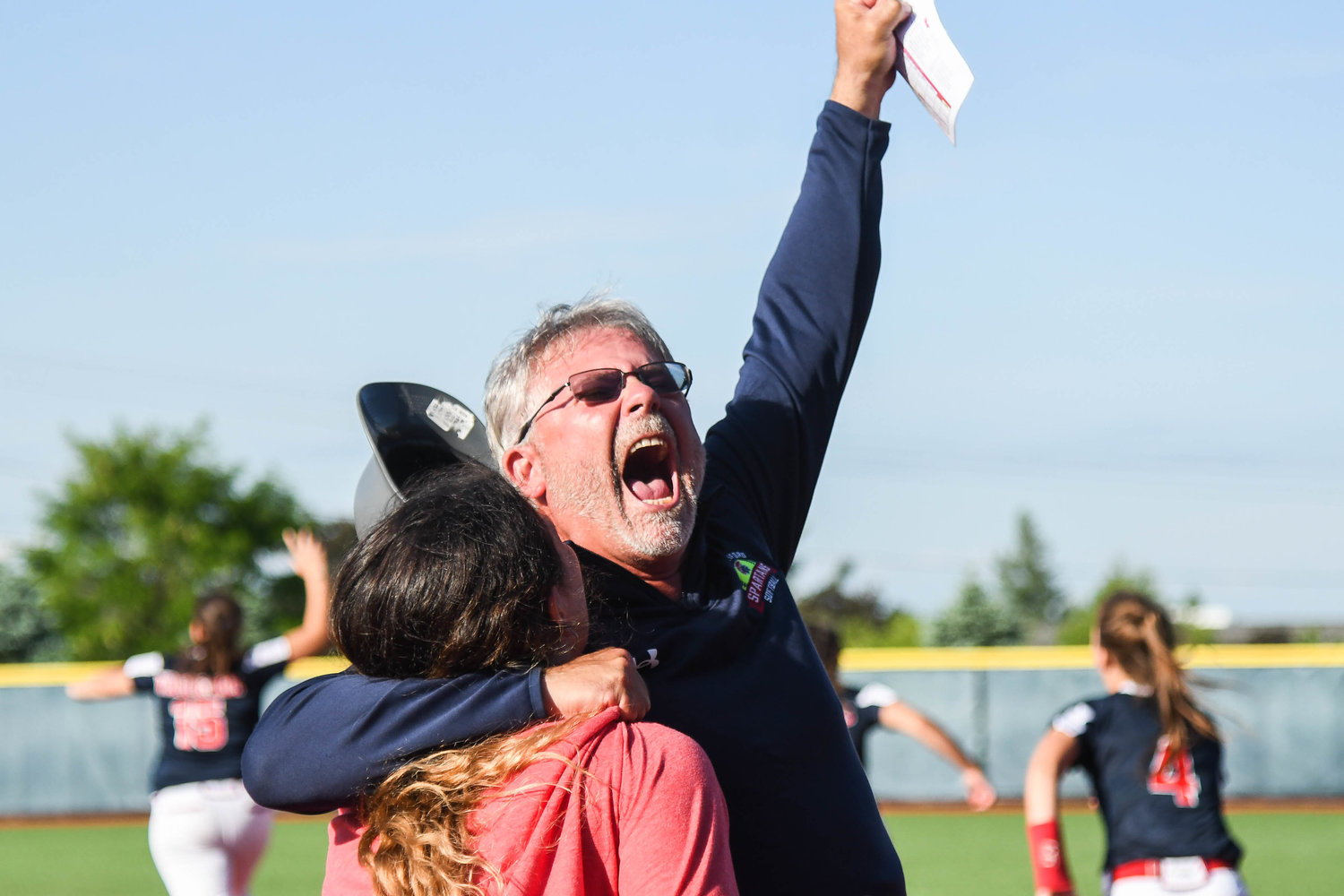 New Hartford head softball coach Dan Stalteri celebrates after winning the Section III Class A title 6-3 over Auburn on Thursday at Onondaga Community College. It is the first full season for Stalteri at the helm, after his first year was wiped out by COVID-19 and last season was only limited games.