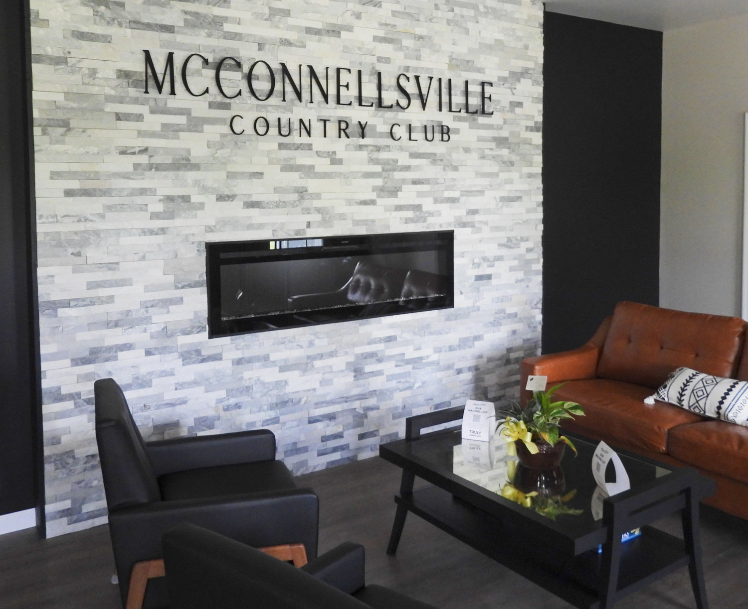 McConnellsville Country Club is under new management and owners Todd and Cindy Bowman are looking to continue the Club's legacy while bringing positive changes that build on it. One of the Club's newest additions is a fireplace, which is nestled right into the wall and one of the first things people see upong entering