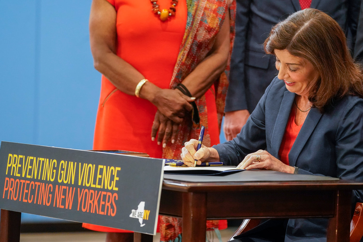 New York Gov. Kathy Hochul signs a package of bills to strengthen gun laws, Monday, June 6, 2022, in New York. New York has strengthened gun laws as part of a series of laws signed this week by Gov. Kathy Hochul with the hope to lessen gun violence and gun-related deaths. Hochul, a Democrat, signed 10 gun-related bills Monday. (AP Photo/Mary Altaffer)
