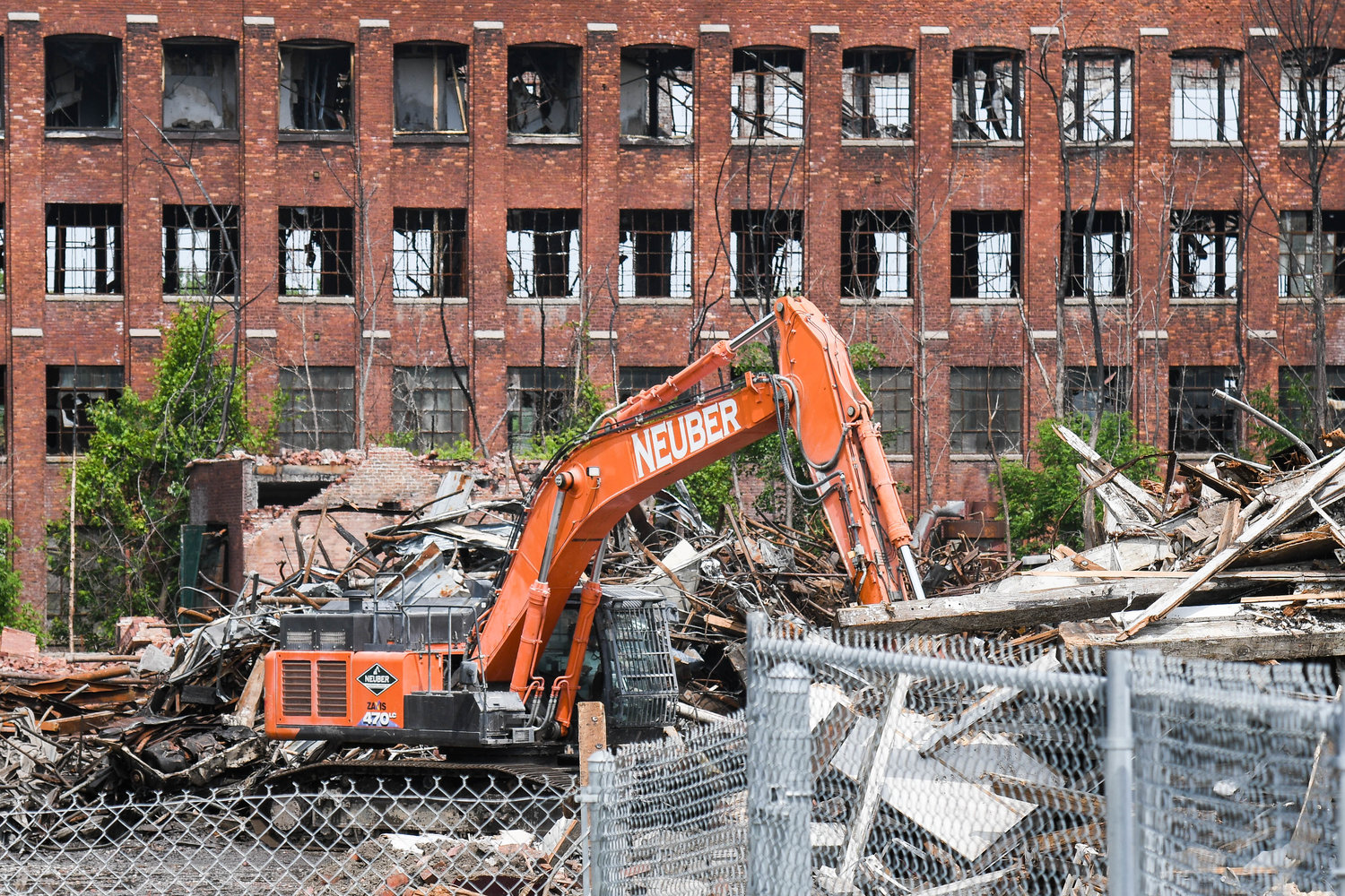 The U.S. Environmental Protection Agency begins to demolish buildings at the Charlestown Mall site.
