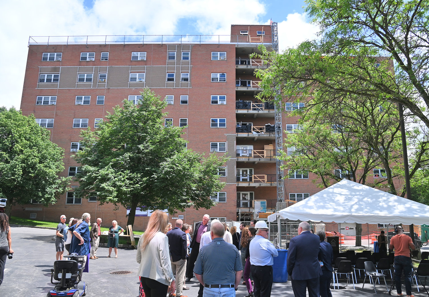 Local and state officials gather for a press conference and ground breaking ceremony for Colonial II Apartments, on Cottage Street, in Rome, which will become the state’s first carbon-neutral public housing building.