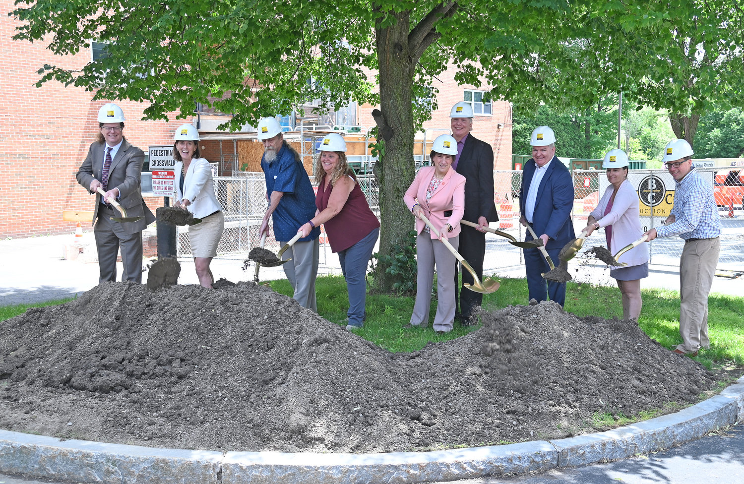State, city and other officials break ground on the Colonial II apartment project Wednesday afternoon. Colonial II will be the state’s first carbon-neutral public housing building, according to officials.
