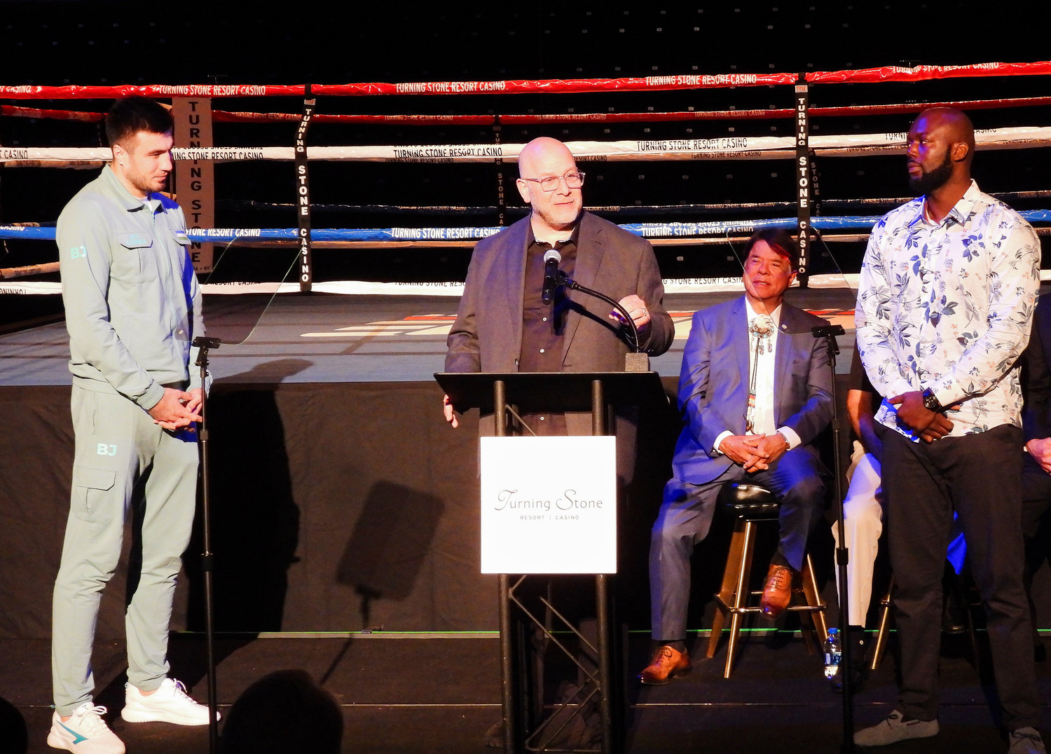 Boxing promoter Lou DiBella, center, talks about the upcoming fight between Bakhodir Jalolov a.k.a “The Big Uzbek,” left, and Jack Mulowayi at a press conference on Thursday kicking off the Hall of Fame Weekend Induction.