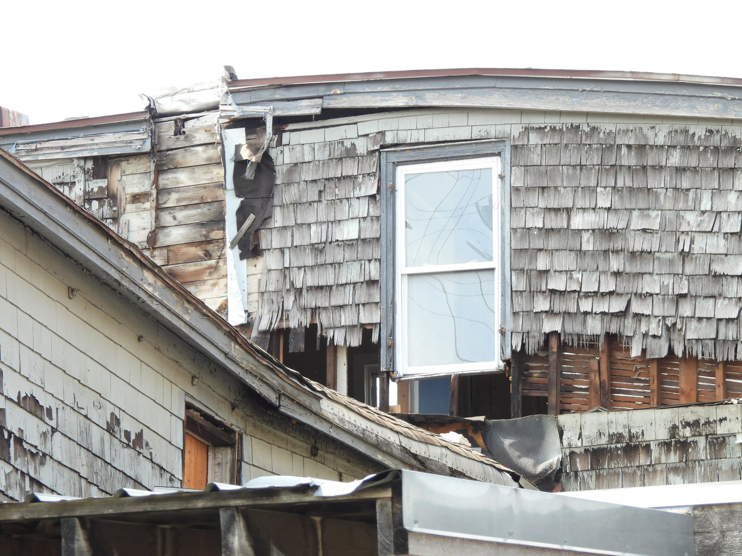 A view of the back of a structure at 140 Madison St., where the building’s wall has given way. Oneida officials have ruled the structure is unsafe and ordered its demolition within 90 days.