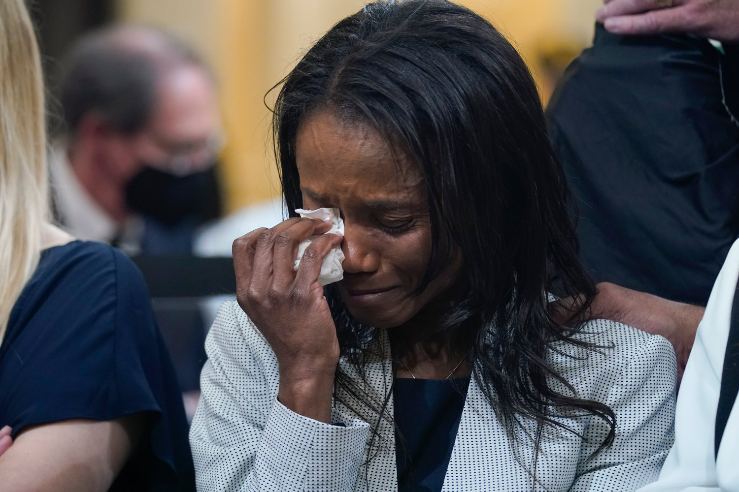 Serena Liebengood, widow of Capitol Police officer Howie Liebengood, cries as a video of the Jan. 6 attack on the U.S. Capitol is played during a public hearing of the House select committee investigating the attack is held on Capitol Hill, Thursday, June 9, 2022, in Washington. (AP Photo/Andrew Harnik)