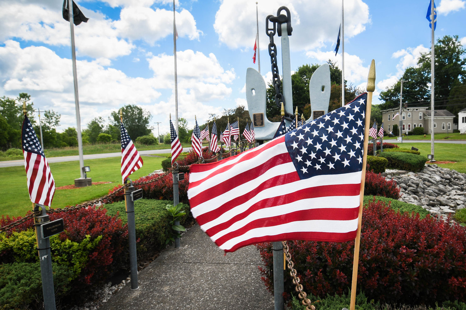 PATRIOTISM ON DISPLAY — American flags decorate the USS Oriskany Anchor Memorial in Trinkaus Park in the village of Oriskany. Today is Flag Day, which commemorates the adoption of the U.S. flag on June 14, 1777, by resolution of the Second Continental Congress.