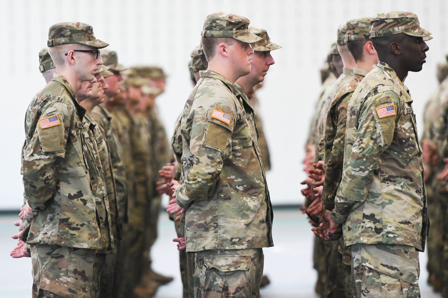 Members of the 2nd Battalion, 108th Infantry of the New York Army National Guard stand at ease during a farewell ceremony hosted by Mohawk Valley Community College on Tuesday morning.