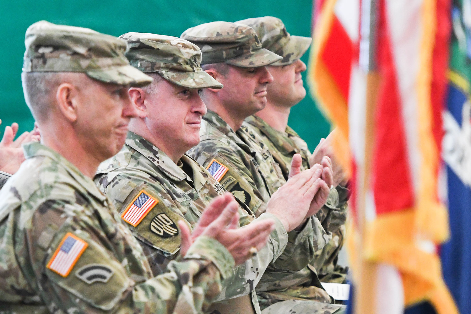 Officers clap as soldiers of the 2nd Battalion, 108th Infantry of the New York Army National Guard are recognized during a farewell ceremony hosted by Mohawk Valley Community College on Tuesday morning.
