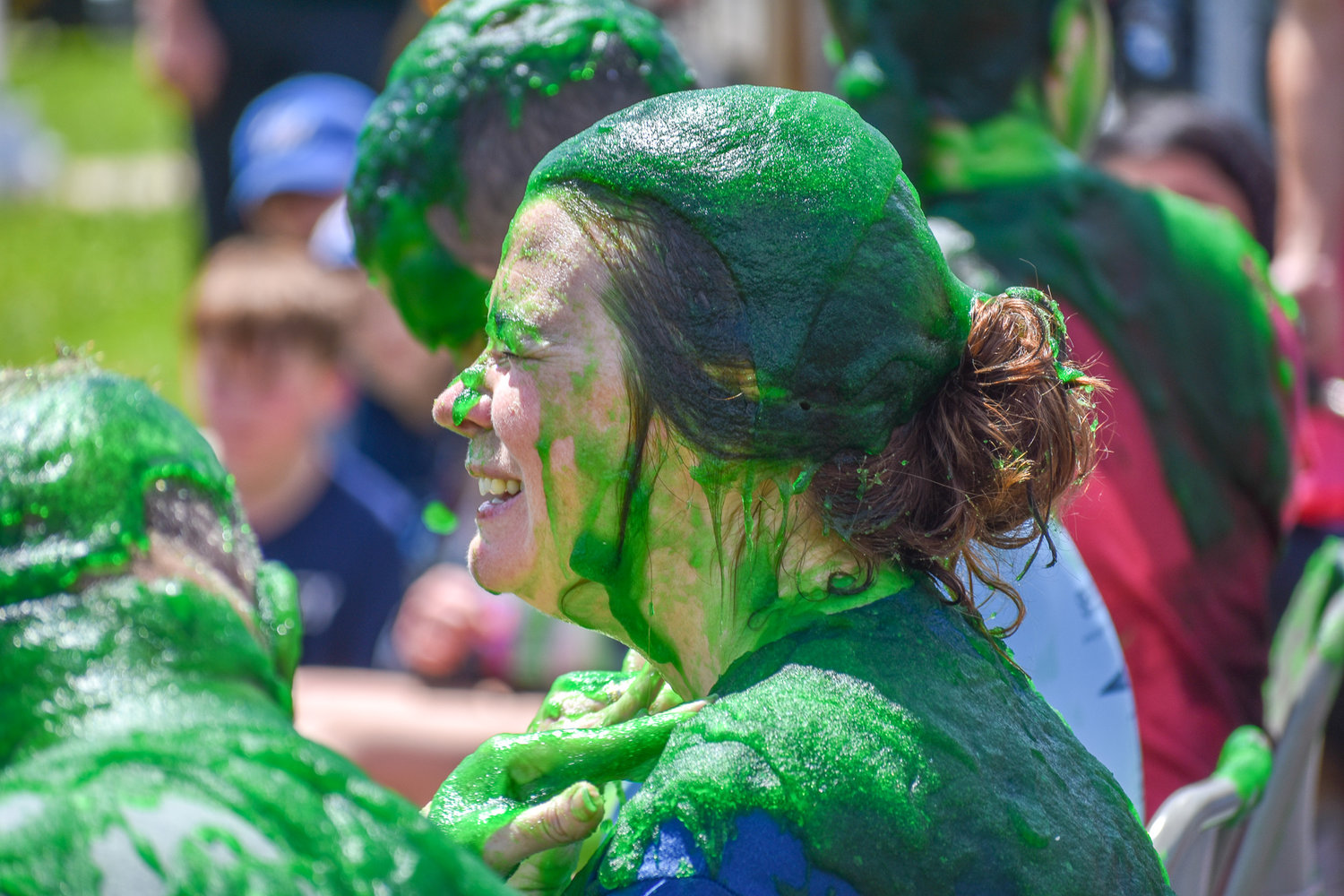 The slime and its jelly-like texture come from mixing a special powder with water. Elementary Principal LeeAnn Cucci is seen covered in the substance.
