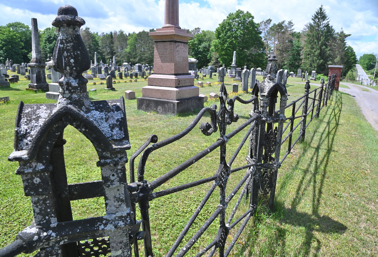 The old fence at the Prospect Cemetery lines a portion of the historic site.  A walking tour, on Saturday, June 25, will share a trove of local history.