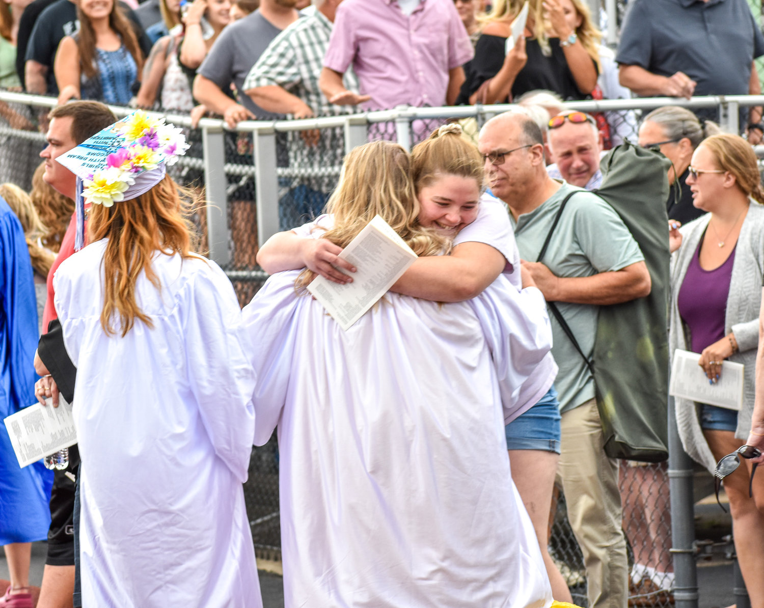 A member of the Camden High School Class of 2022 shares an embrace after graduation.