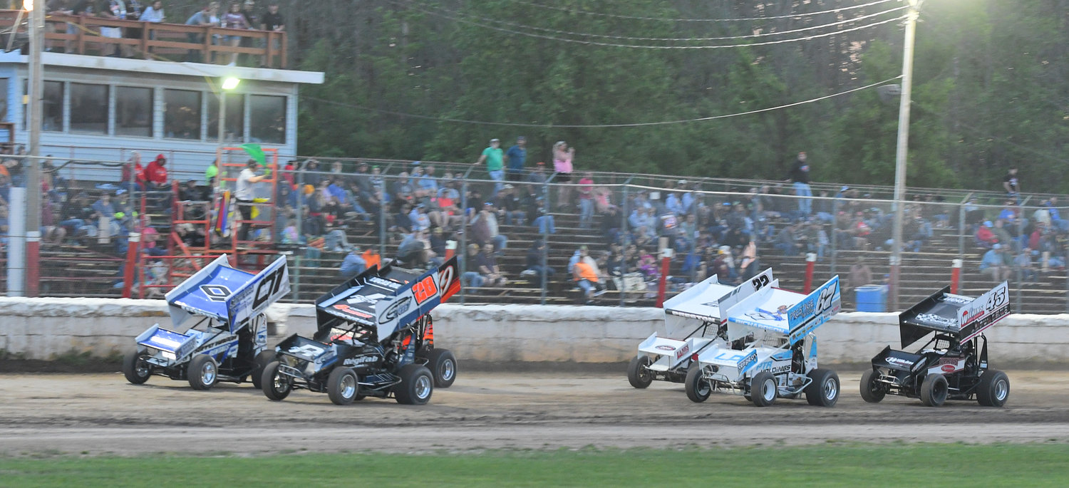 AND THEY’RE OFF — Pictured is the start of the Patriot Sprint Tour 360 heat race in front of the Utica-Rome Speedway crowd last Friday night. Danny Varin, 01, of Fonda won the feature race.