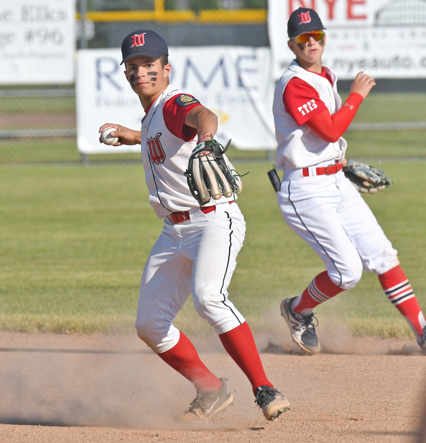 Whitestown Post second baseman Anthony Sawanec makes a throw to first base for an out with shortstop Kody Czternastek backing him up during Monday’s American Legion game against New Hartford Post at DeLutis Field in Rome. Game details were unavailable as of press time.