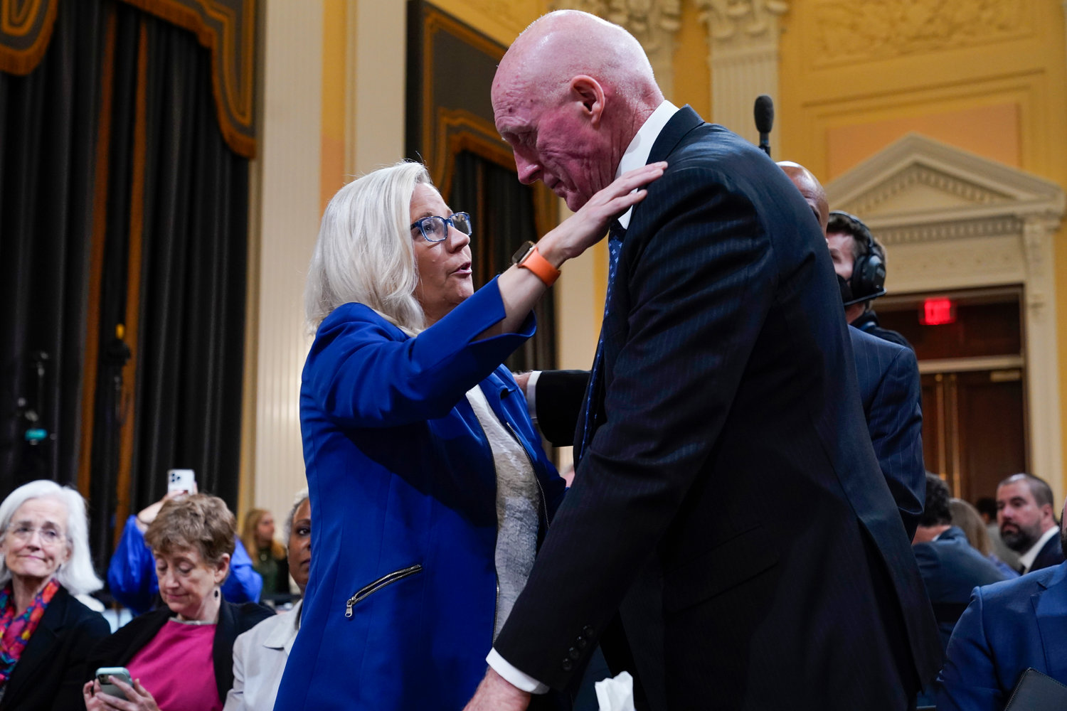Vice chair Rep. Liz Cheney, R-Wyo., hugs Rusty Bowers, Arizona state House Speaker, during a break as the House select committee investigating the Jan. 6 attack on the U.S. Capitol continues to reveal its findings of a year-long investigation, at the Capitol in Washington Tuesday.