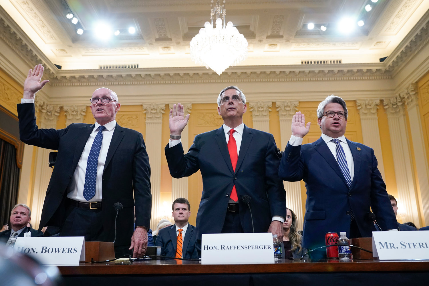 Rusty Bowers, Arizona state House Speaker, from left, Brad Raffensperger, Georgia Secretary of State, and Gabe Sterling, Georgia Deputy Secretary of State, are sworn in to testify as the House select committee investigating the Jan. 6 attack on the U.S. Capitol continues to reveal its findings of a year-long investigation, at the Capitol in Washington, Tuesday, June 21, 2022. (AP Photo/Jacquelyn Martin)
