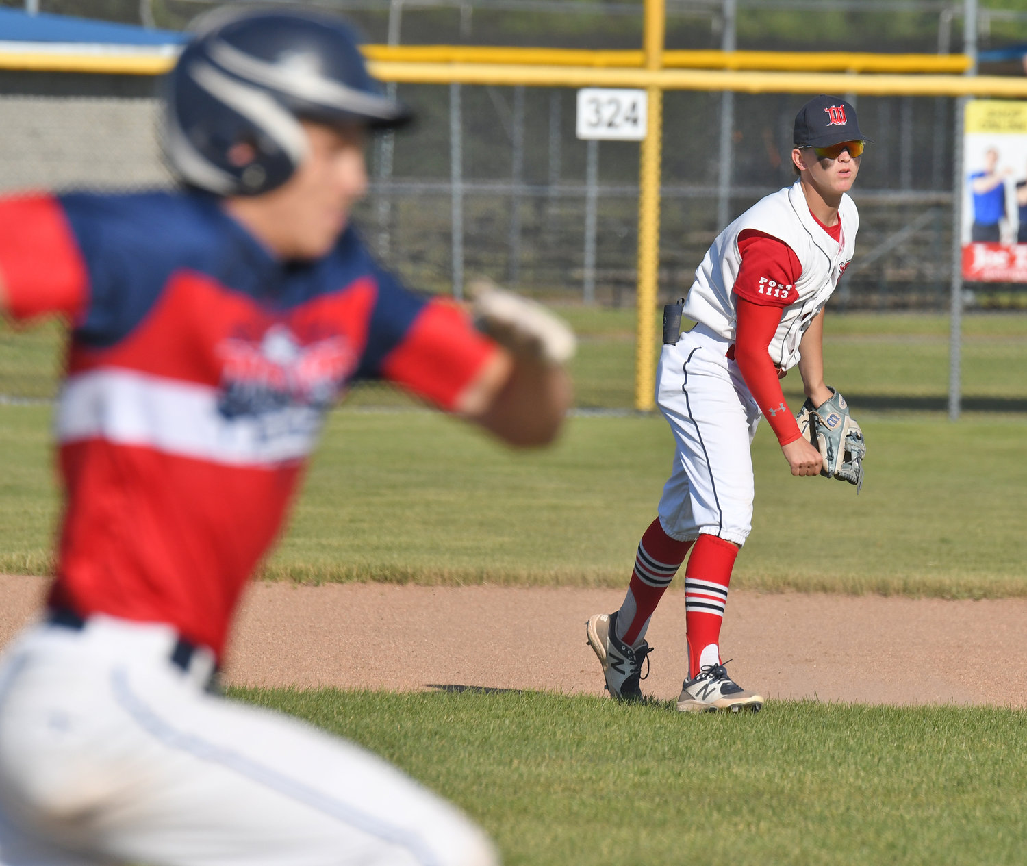 Whitestown Kody Czternastek watches his throw to first for an out in the second inning of the team's 9-1 win over New Hartford Monday. Czternastek also had a single and scored a run.