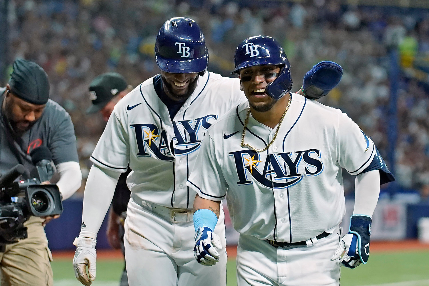 Tampa Bay Rays’ Isaac Paredes, right, celebrates with Yandy Diaz after Paredes hit a two-run home run off New York Yankees pitcher Clarke Schmidt during the fifth inning of a game Tuesday night in St. Petersburg, Fla. The Rays won 5-4.