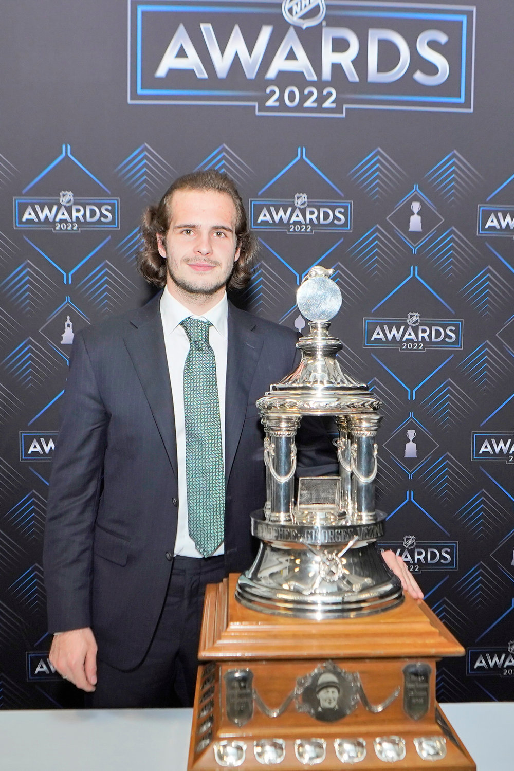 New York Rangers goalie Igor Shesterkin poses with the Vezina Trophy after the NHL awards Tuesday night in Tampa, Fla. The Vezina Trophy is presented annually to the leagues’ best goalie.