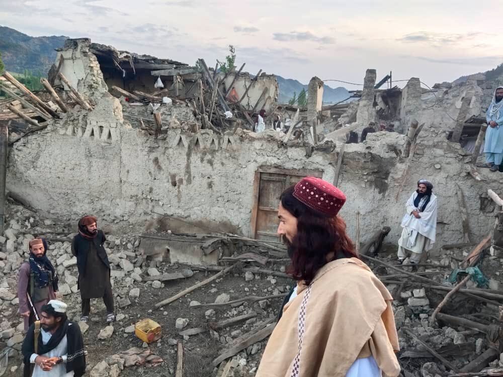 Afghans look at destruction caused by an earthquake in the province of Paktika, eastern Afghanistan, Wednesday. The disaster inflicted by the 6.1-magnitude quake heaps more misery on a country where millions face increasing hunger and poverty.
